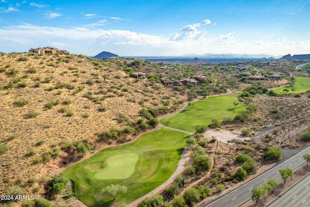 drone / aerial view with a mountain view and golf course view