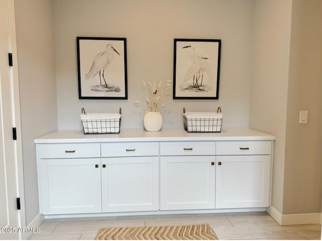 room details featuring baseboards and wood finished floors