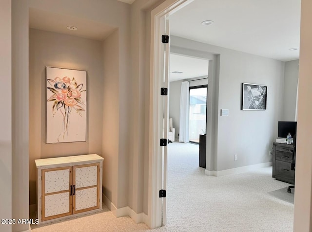 hallway featuring baseboards, carpet, and recessed lighting