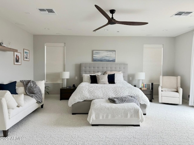 bedroom featuring carpet floors, ceiling fan, and visible vents