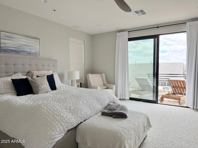 bedroom featuring visible vents, carpet, and access to outside