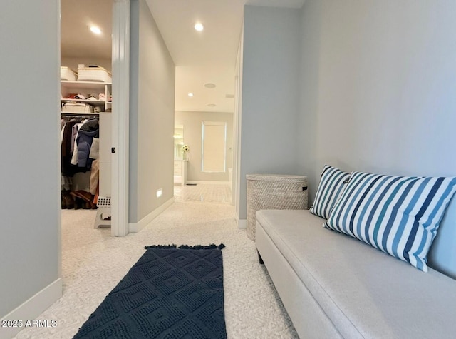 interior space featuring recessed lighting, baseboards, and carpet