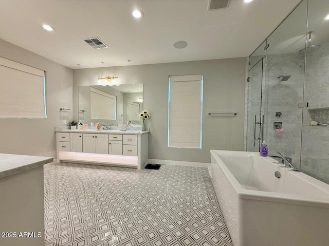 bathroom featuring visible vents, a stall shower, vanity, a soaking tub, and recessed lighting