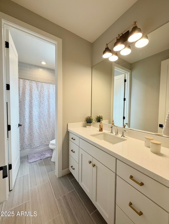 full bathroom with vanity, toilet, baseboards, wood tiled floor, and shower / tub combo
