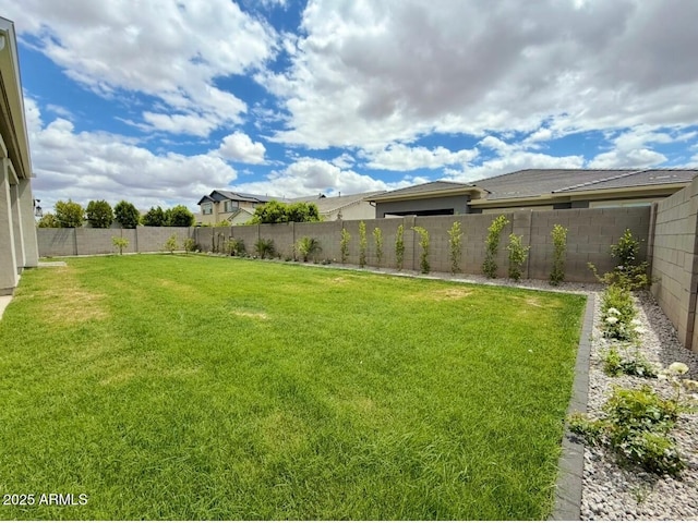 view of yard with a fenced backyard
