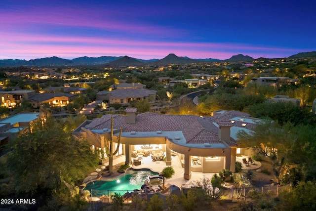 aerial view at dusk with a mountain view