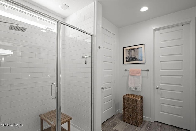 435 E Shellie Ct, Casa Grande, AZ 85122 - full bathroom with a shower stall, wood finished floors, and baseboards