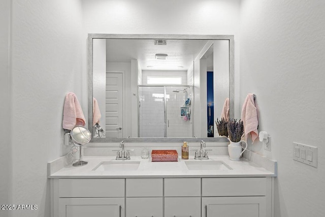 435 E Shellie Ct, Casa Grande, AZ 85122 - full bath with double vanity, a stall shower, and a textured wall