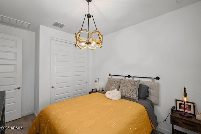 435 E Shellie Ct, Casa Grande, AZ 85122 - bedroom with a chandelier, carpet flooring, a closet, and baseboards