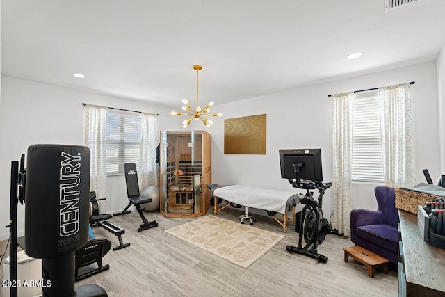 435 E Shellie Ct, Casa Grande, AZ 85122 - workout area featuring light wood-type flooring, a chandelier, and recessed lighting