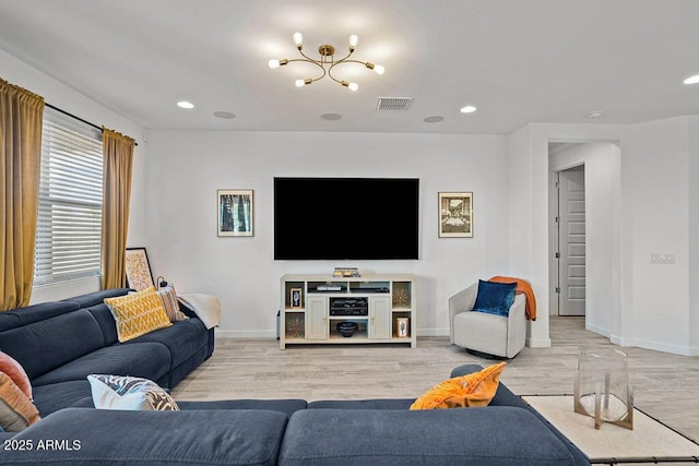435 E Shellie Ct, Casa Grande, AZ 85122 - living room with baseboards, light wood-type flooring, recessed lighting, and a chandelier