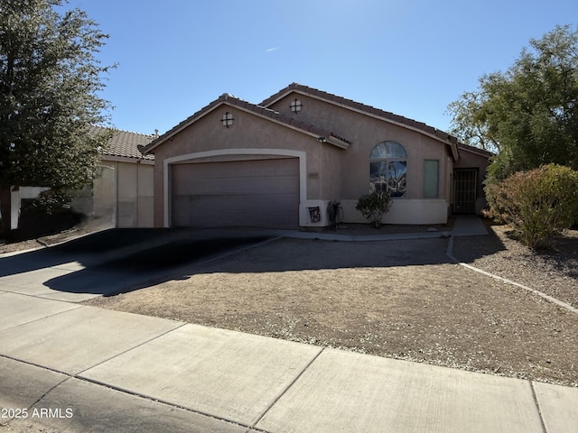 45499 W Sky Ln, Maricopa, AZ 85139 - ranch-style home featuring driveway, a garage, stucco siding, and a tiled roof