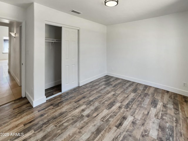 317 E Nunneley Rd, Gilbert, AZ 85296 - unfurnished bedroom with wood finished floors and a closet