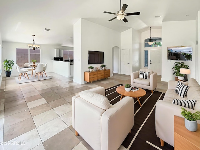 317 E Nunneley Rd, Gilbert, AZ 85296 - living area with ceiling fan, a chandelier, arched walkways, light tile patterned floors, and lofted ceiling