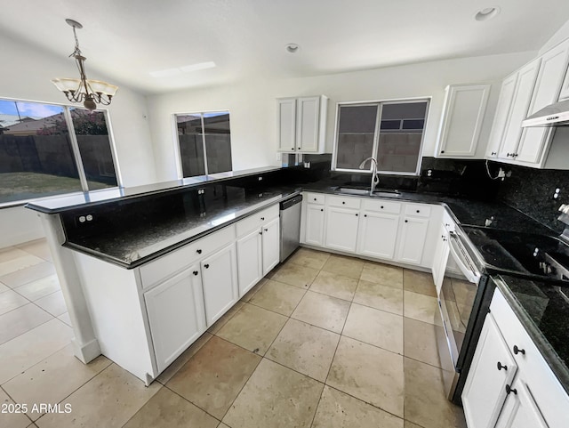 317 E Nunneley Rd, Gilbert, AZ 85296 - kitchen with stainless steel appliances, a chandelier, a peninsula, white cabinets, and recessed lighting