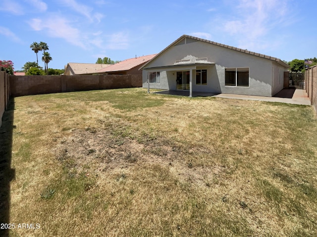 317 E Nunneley Rd, Gilbert, AZ 85296 - rear view of property with stucco siding, a fenced backyard, and a patio area