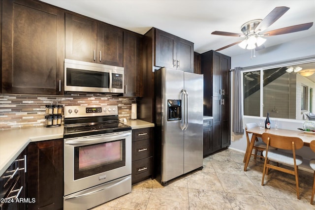 kitchen with dark brown cabinetry, decorative backsplash, and appliances with stainless steel finishes