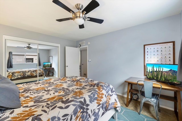 carpeted bedroom featuring ceiling fan and a closet