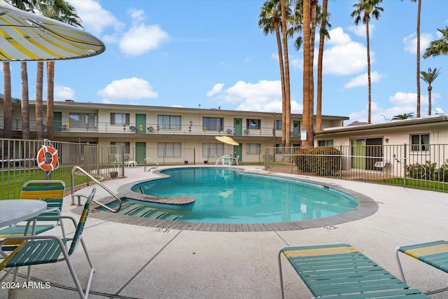 view of swimming pool with a patio area