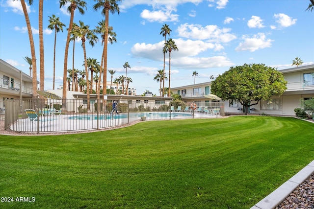 view of yard featuring a patio area and a community pool