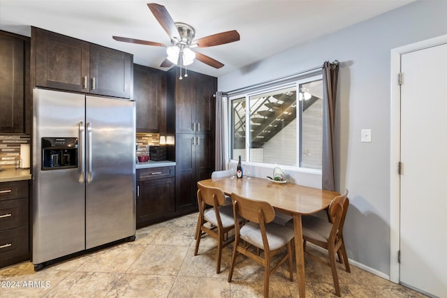 kitchen with dark brown cabinetry, stainless steel fridge with ice dispenser, and tasteful backsplash