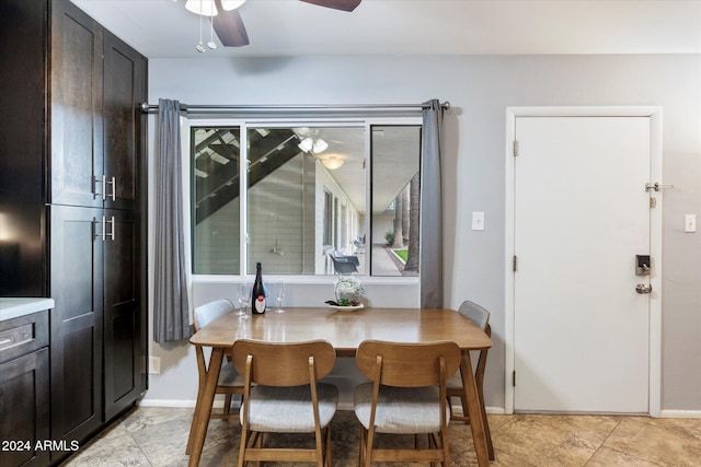 tiled dining room with ceiling fan