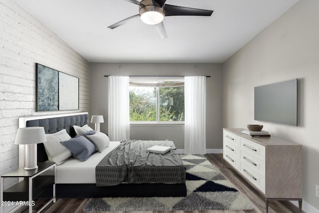 bedroom with dark wood-type flooring and ceiling fan