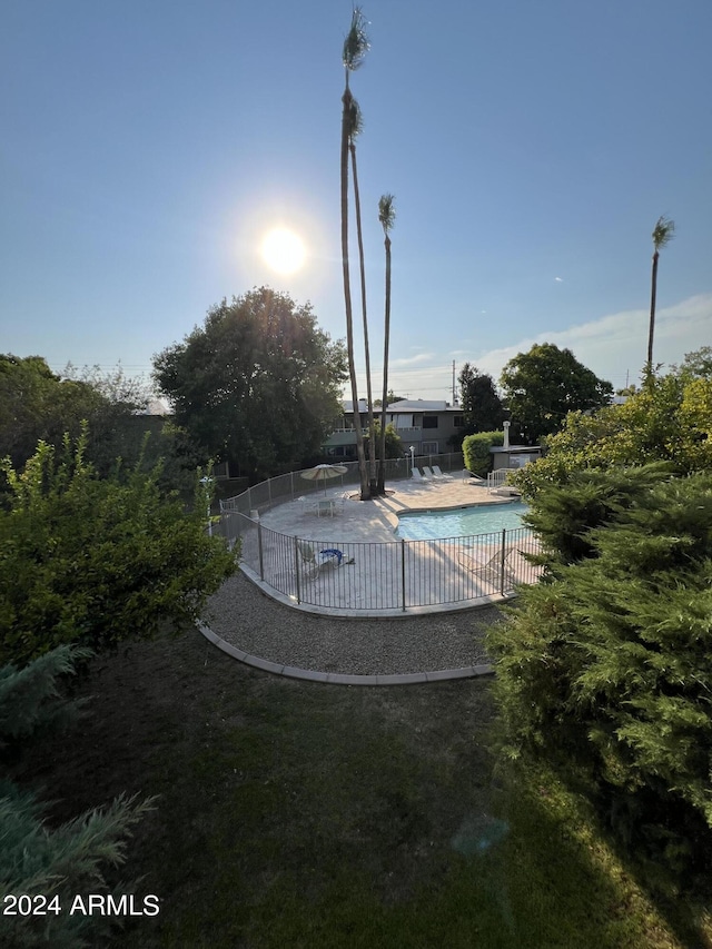 view of swimming pool with a patio