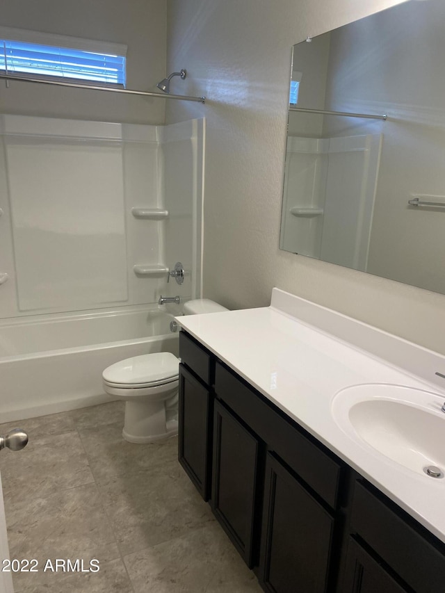 full bathroom featuring vanity, washtub / shower combination, and toilet