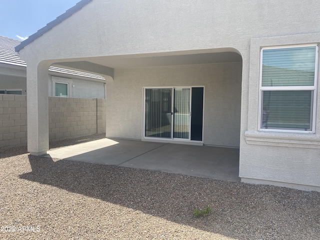 back of property with a patio area