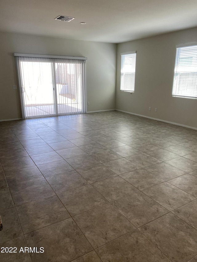 unfurnished room featuring tile patterned floors