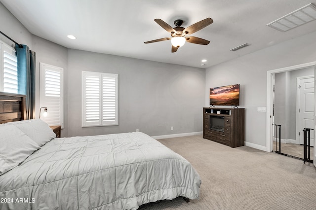 bedroom with light carpet and ceiling fan