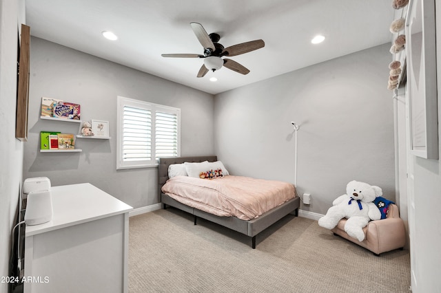 bedroom featuring light carpet and ceiling fan