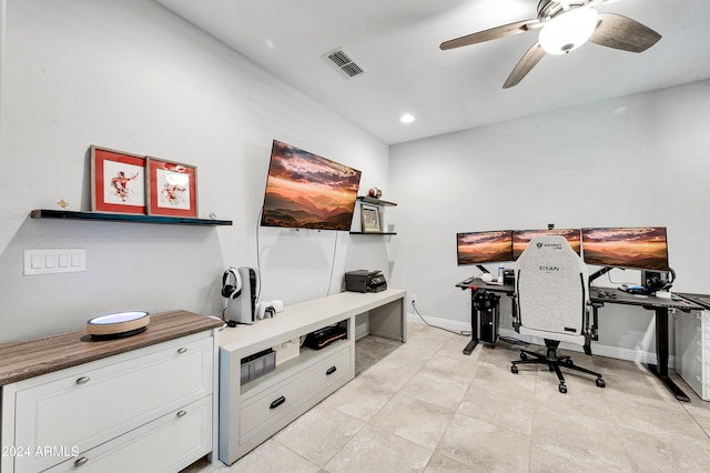 tiled home office featuring ceiling fan