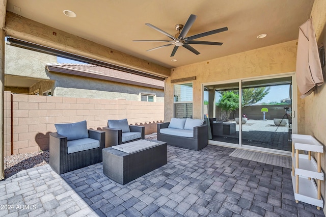 view of patio with an outdoor living space and ceiling fan