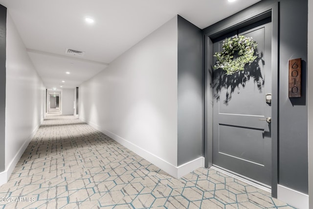interior space with baseboards, visible vents, and recessed lighting