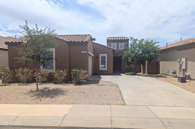14841 W Desert Hills Dr, Surprise, AZ 85379 - view of front of property featuring driveway, stucco siding, a tiled roof, and an attached garage