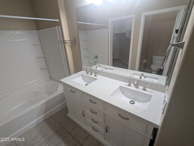 14841 W Desert Hills Dr, Surprise, AZ 85379 - bathroom with toilet, tile patterned floors, double vanity, and shower / bath combination