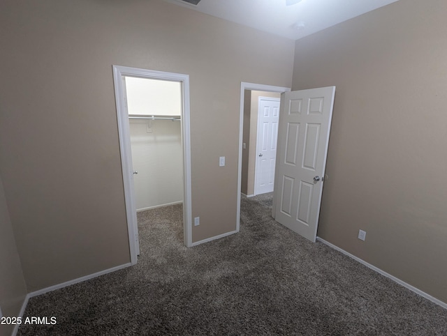 14841 W Desert Hills Dr, Surprise, AZ 85379 - unfurnished bedroom with carpet, a spacious closet, baseboards, and a closet