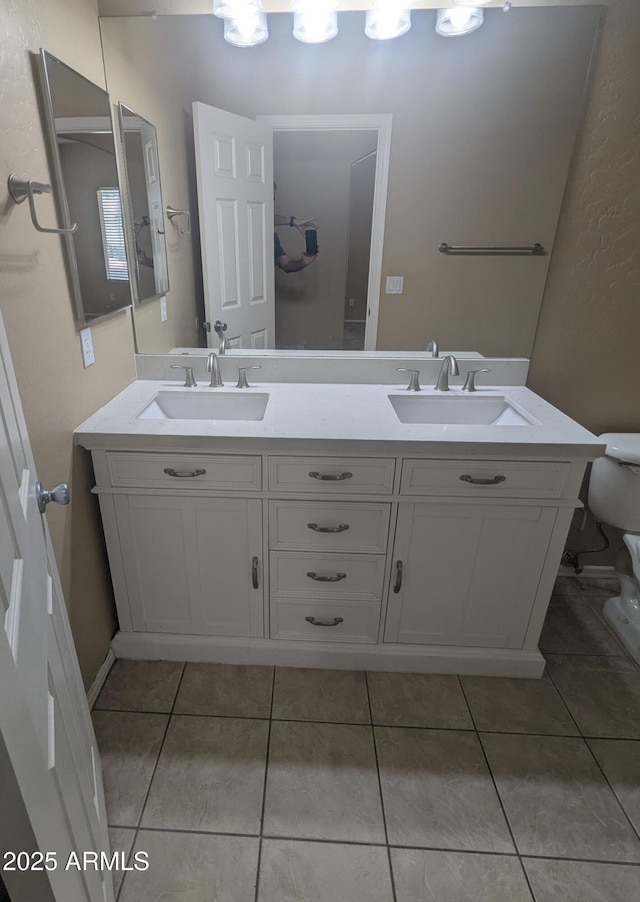 14841 W Desert Hills Dr, Surprise, AZ 85379 - bathroom with double vanity, toilet, and tile patterned flooring