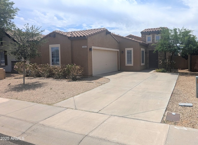 14841 W Desert Hills Dr, Surprise, AZ 85379 - mediterranean / spanish-style home featuring stucco siding, driveway, an attached garage, and a tiled roof