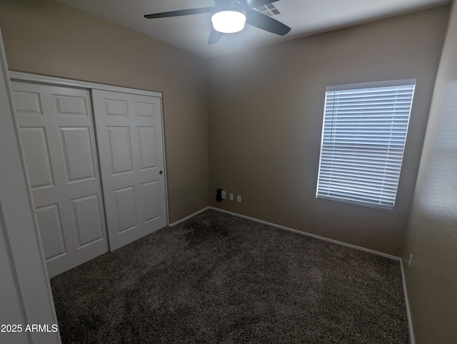 14841 W Desert Hills Dr, Surprise, AZ 85379 - unfurnished bedroom with carpet floors, a closet, baseboards, and a ceiling fan