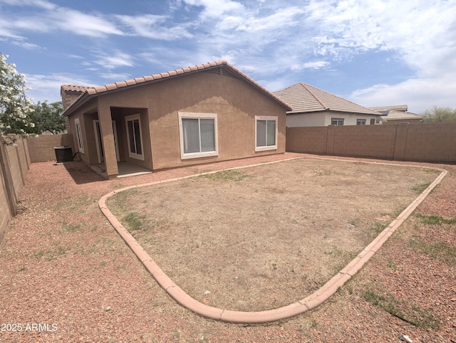 14841 W Desert Hills Dr, Surprise, AZ 85379 - rear view of property featuring a tiled roof, stucco siding, and a fenced backyard