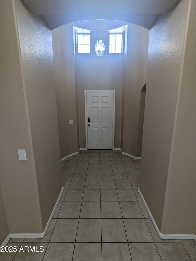 14841 W Desert Hills Dr, Surprise, AZ 85379 - entryway with light tile patterned floors and baseboards