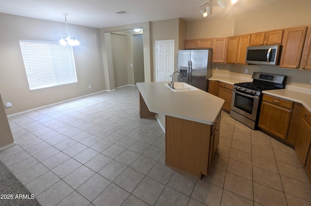 14841 W Desert Hills Dr, Surprise, AZ 85379 - kitchen with appliances with stainless steel finishes, light tile patterned floors, light countertops, and a chandelier