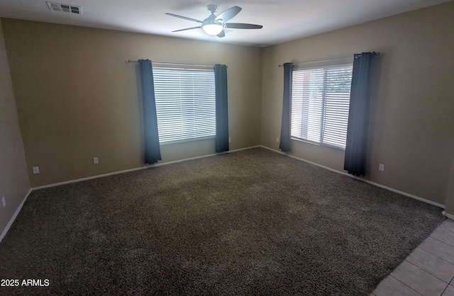 14841 W Desert Hills Dr, Surprise, AZ 85379 - carpeted empty room with a ceiling fan, baseboards, and tile patterned flooring