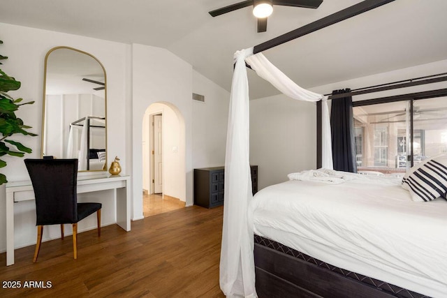 bedroom with lofted ceiling and dark wood-type flooring