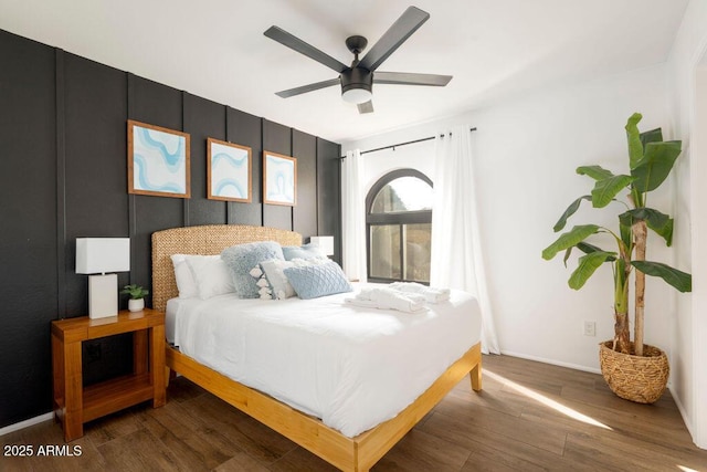 bedroom featuring dark hardwood / wood-style floors and ceiling fan