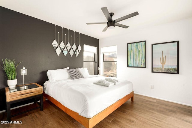 bedroom with hardwood / wood-style flooring and ceiling fan