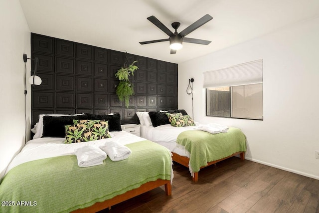 bedroom featuring hardwood / wood-style flooring and ceiling fan